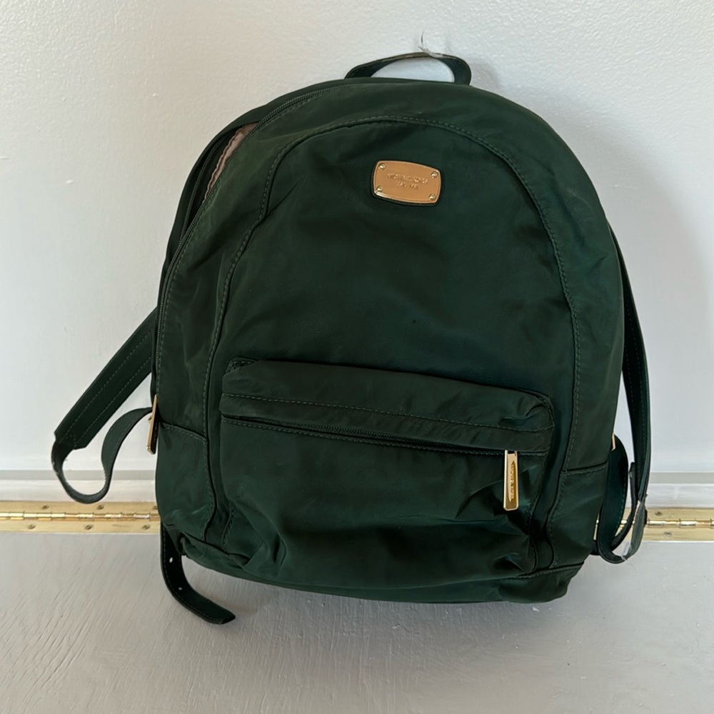 Hunter green Michael Kors nylon back pack with leather straps